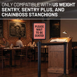 Restaurant setting with a 'Please Wait to be Seated' sign on a stand, text indicating compatibility with specific stanchions.